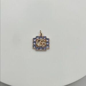 670. GG Gold and Purple‎ Charm